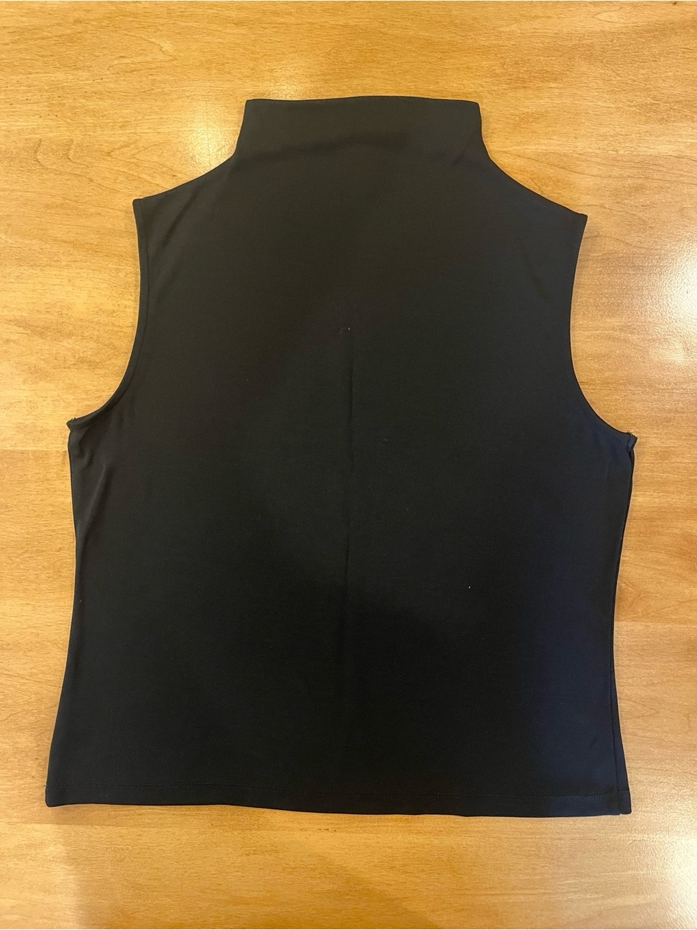 Black sleeveless mock neck top by Anne Klein